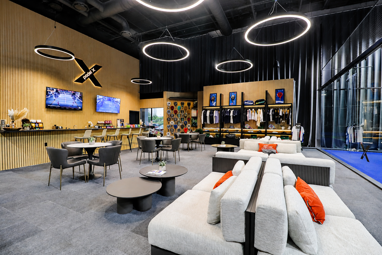 Indoor padel courts and lounge area at Padel X Boca Raton